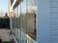Veranda, Veranda Plaza, Glazen schuifwanden, terrasoverkapping, overkapping, buitenkamer, tuinkamer, Carport houtkachel, lichtstraat, daklicht, balustrade, hekwerk, terrasverwarming, tuin, terras, houten vloer.