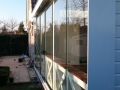 Veranda, Veranda Plaza, Glazen schuifwanden, terrasoverkapping, overkapping, buitenkamer, tuinkamer, Carport houtkachel, lichtstraat, daklicht, balustrade, hekwerk, terrasverwarming, tuin, terras, houten vloer.