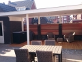 Veranda, Veranda Plaza, Glazen schuifwanden, terrasoverkapping, overkapping, buitenkamer, tuinkamer, Carport houtkachel, lichtstraat, daklicht, balustrade, terrasverwarming, tuin, terras, houten vloer.