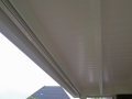 Veranda, Veranda Plaza, Glazen schuifwanden, terrasoverkapping, overkapping, buitenkamer, tuinkamer, Carport houtkachel, lichtstraat, daklicht, balustrade, terrasverwarming, tuin, terras, houten vloer.