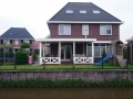 Veranda, Veranda Plaza, Glazen schuifwanden, terrasoverkapping, overkapping, buitenkamer, tuinkamer, Carport houtkachel, lichtstraat, daklicht, balustrade, terrasverwarming, tuin, terras, houten vloer.