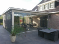 Veranda, Veranda Plaza,  terrasoverkapping, overkapping, buitenkamer, tuinkamer, Carport houtkachel, lichtstraat, daklicht, Glazen schuifwanden, balustrade, hekwerk, terrasverwarming, tuin, terras, houten vlondervloer.