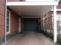 Carport Veranda, Veranda Plaza, Glazen schuifwanden, terrasoverkapping, overkapping, buitenkamer, tuinkamer, houtkachel, lichtstraat, daklicht, balustrade, terrasverwarming, tuin, terras, houten vloer.