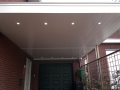 Carport Veranda, Veranda Plaza, Glazen schuifwanden, terrasoverkapping, overkapping, buitenkamer, tuinkamer, houtkachel, lichtstraat, daklicht, balustrade, terrasverwarming, tuin, terras, houten vloer.