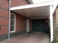 Carport Veranda, Veranda Plaza, Glazen schuifwanden, terrasoverkapping, overkapping, buitenkamer, tuinkamer, houtkachel, lichtstraat, daklicht, balustrade, terrasverwarming, tuin, terras, houten vloer.