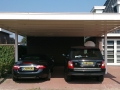 Carport Veranda, Veranda Plaza, Glazen schuifwanden, terrasoverkapping, overkapping, buitenkamer, tuinkamer, houtkachel, lichtstraat, daklicht, balustrade, terrasverwarming, tuin, terras, houten vloer.