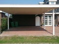 Carport Veranda, Veranda Plaza, Glazen schuifwanden, terrasoverkapping, overkapping, buitenkamer, tuinkamer, houtkachel, lichtstraat, daklicht, balustrade, terrasverwarming, tuin, terras, houten vloer.