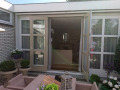 Veranda, Veranda Plaza,  terrasoverkapping, overkapping, buitenkamer, tuinkamer, Carport houtkachel, lichtstraat, daklicht, Glazen schuifwanden, balustrade, hekwerk, terrasverwarming, tuin, terras, houten vlondervloer.