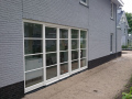 Veranda, Veranda Plaza,  terrasoverkapping, overkapping, buitenkamer, tuinkamer, Carport houtkachel, lichtstraat, daklicht, Glazen schuifwanden, balustrade, hekwerk, terrasverwarming, tuin, terras, houten vlondervloer.
