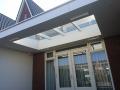 Veranda, Veranda Plaza, terrasoverkapping, overkapping, buitenkamer, tuinkamer, Carport houtkachel, lichtstraat, daklicht, Glazen schuifwanden, balustrade, hekwerk, terrasverwarming, tuin, terras, houten vlondervloer.
