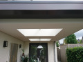 Veranda, Veranda Plaza, terrasoverkapping, overkapping, buitenkamer, tuinkamer, Carport houtkachel, lichtstraat, daklicht, glazen schuifwanden, balustrade, hekwerk, terrasverwarming, tuin, terras, houten vlondervloer.