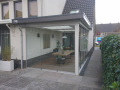 Veranda, Veranda Plaza, terrasoverkapping, overkapping, buitenkamer, tuinkamer, Carport houtkachel, lichtstraat, daklicht, glazen schuifwanden, balustrade, hekwerk, terrasverwarming, tuin, terras, houten vlondervloer.