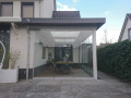 Veranda, Veranda Plaza, terrasoverkapping, overkapping, buitenkamer, tuinkamer, Carport houtkachel, lichtstraat, daklicht, glazen schuifwanden, balustrade, hekwerk, terrasverwarming, tuin, terras, houten vlondervloer.