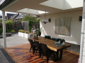 Veranda, Veranda Plaza, terrasoverkapping, overkapping, buitenkamer, tuinkamer, Carport houtkachel, lichtstraat, daklicht, glazen schuifwanden, balustrade, hekwerk, terrasverwarming, tuin, terras, houten vlondervloer.
