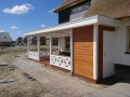 Veranda, Veranda Plaza, terrasoverkapping, overkapping, buitenkamer, tuinkamer, Carport houtkachel, lichtstraat, daklicht, Glazen schuifwanden, balustrade, hekwerk, terrasverwarming, tuin, terras, houten vlondervloer.