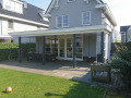 Veranda, Veranda Plaza, terrasoverkapping, overkapping, buitenkamer, tuinkamer, Carport houtkachel, lichtstraat, daklicht, Glazen schuifwanden, balustrade, hekwerk, terrasverwarming, tuin, terras, houten vlondervloer.
