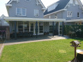 Veranda, Veranda Plaza, terrasoverkapping, overkapping, buitenkamer, tuinkamer, Carport houtkachel, lichtstraat, daklicht, Glazen schuifwanden, balustrade, hekwerk, terrasverwarming, tuin, terras, houten vlondervloer.