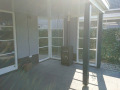 Veranda, Veranda Plaza, terrasoverkapping, overkapping, buitenkamer, tuinkamer, Carport houtkachel, lichtstraat, daklicht, Glazen schuifwanden, balustrade, hekwerk, terrasverwarming, tuin, terras, houten vlondervloer.