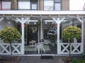 Veranda, Veranda Plaza, Glazen schuifwanden, terrasoverkapping, overkapping, buitenkamer, tuinkamer, Carport houtkachel, lichtstraat, daklicht, balustrade, hekwerk, terrasverwarming, tuin, terras, houten vloer.