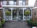 Veranda, Veranda Plaza, Glazen schuifwanden, terrasoverkapping, overkapping, buitenkamer, tuinkamer, Carport houtkachel, lichtstraat, daklicht, balustrade, hekwerk, terrasverwarming, tuin, terras, houten vloer.