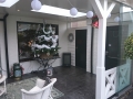 Veranda, Veranda Plaza, Glazen schuifwanden, terrasoverkapping, overkapping, buitenkamer, tuinkamer, Carport houtkachel, lichtstraat, daklicht, balustrade, hekwerk, terrasverwarming, tuin, terras, houten vloer.