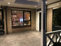 Veranda, Veranda Plaza, Glazen schuifwanden, terrasoverkapping, overkapping, buitenkamer, tuinkamer, Carport houtkachel, lichtstraat, daklicht, balustrade, hekwerk, terrasverwarming, tuin, terras, houten vloer.