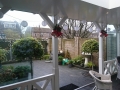 Veranda, Veranda Plaza, Glazen schuifwanden, terrasoverkapping, overkapping, buitenkamer, tuinkamer, Carport houtkachel, lichtstraat, daklicht, balustrade, hekwerk, terrasverwarming, tuin, terras, houten vloer.