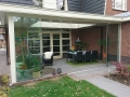 Veranda, Veranda Plaza, Glazen schuifwanden, terrasoverkapping, overkapping, buitenkamer, tuinkamer, Carport houtkachel, lichtstraat, daklicht, balustrade, hekwerk, terrasverwarming, tuin, terras, houten vloer.