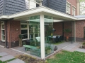 Veranda, Veranda Plaza, Glazen schuifwanden, terrasoverkapping, overkapping, buitenkamer, tuinkamer, Carport houtkachel, lichtstraat, daklicht, balustrade, hekwerk, terrasverwarming, tuin, terras, houten vloer.