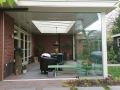 Veranda, Veranda Plaza, Glazen schuifwanden, terrasoverkapping, overkapping, buitenkamer, tuinkamer, Carport houtkachel, lichtstraat, daklicht, balustrade, hekwerk, terrasverwarming, tuin, terras, houten vloer.