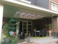 Veranda, Veranda Plaza, Glazen schuifwanden, terrasoverkapping, overkapping, buitenkamer, tuinkamer, Carport houtkachel, lichtstraat, daklicht, balustrade, hekwerk, terrasverwarming, tuin, terras, houten vloer.