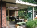 Veranda, Veranda Plaza, Glazen schuifwanden, terrasoverkapping, overkapping, buitenkamer, tuinkamer, Carport houtkachel, lichtstraat, daklicht, balustrade, hekwerk, terrasverwarming, tuin, terras, houten vloer.