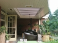 Veranda, Veranda Plaza, Glazen schuifwanden, terrasoverkapping, overkapping, buitenkamer, tuinkamer, Carport houtkachel, lichtstraat, daklicht, balustrade, hekwerk, terrasverwarming, tuin, terras, houten vloer.