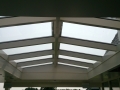 Exclusieve Veranda terrasoverkapping van Veranda Plaza in AmstelveVeranda, Veranda Plaza, terrasoverkapping, overkapping, buitenkamer, tuinkamer, houtkachel, lichtstraat, Glazen schuifwanden, daklicht, balustrade, terrasverwarming, tuin, terras carport, terras, vlonderen